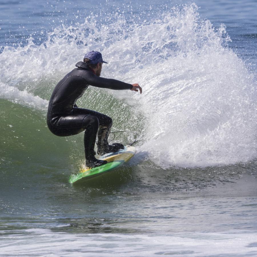 Surfer riding waves at Fort Ebey.