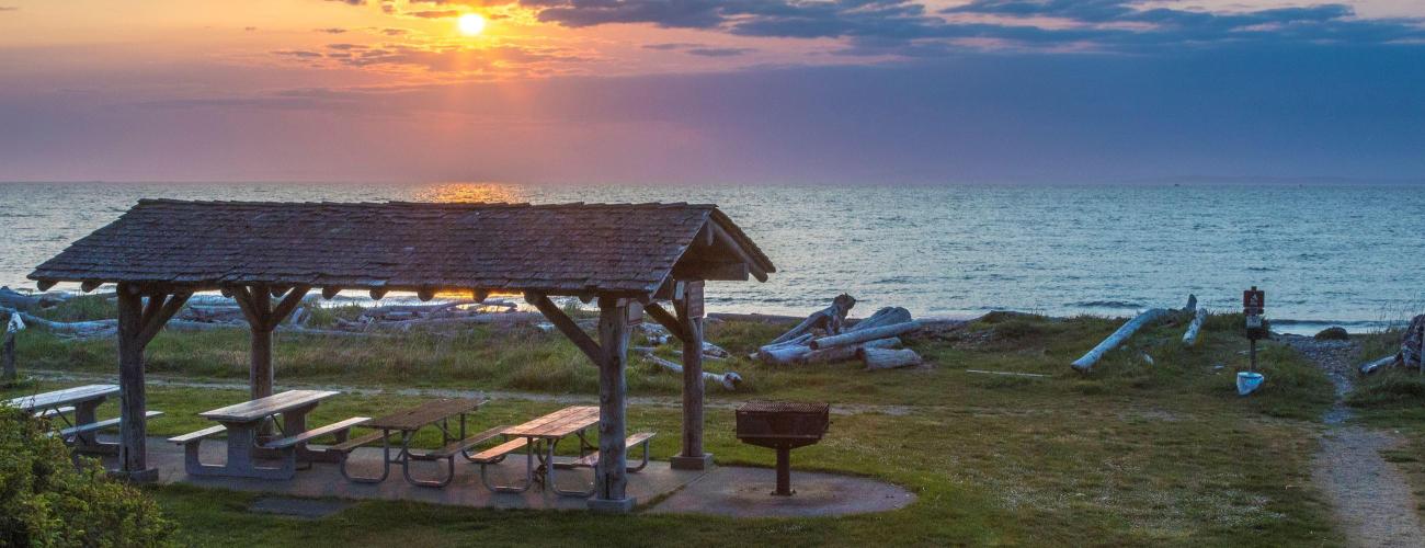 Colorful sunset with picnic shelter at Joseph Whidbey State Park