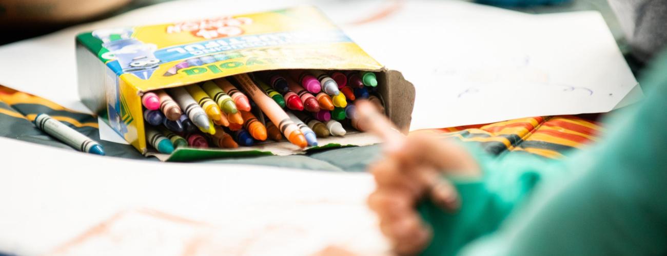 Kid coloring with Crayola crayons