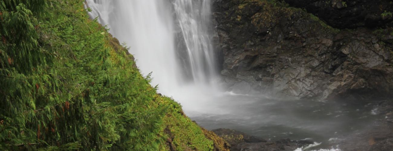 waterfalls plunging into river