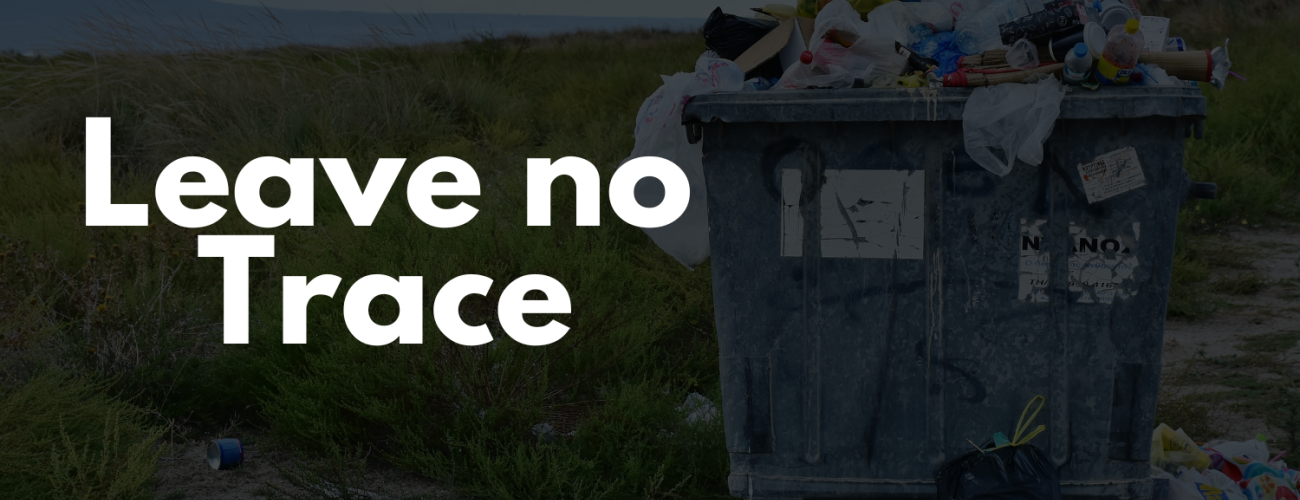 The words "leave no trace" in white letters with trash in a natural area in the background.