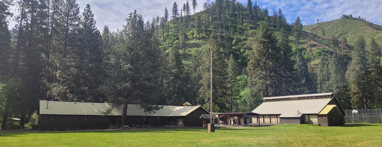 Camp Wooten Retreat Center mess hall with beautiful tree covered hills in the background