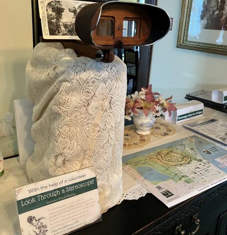 Display of antique stereoscope, maps and interpretive signage.