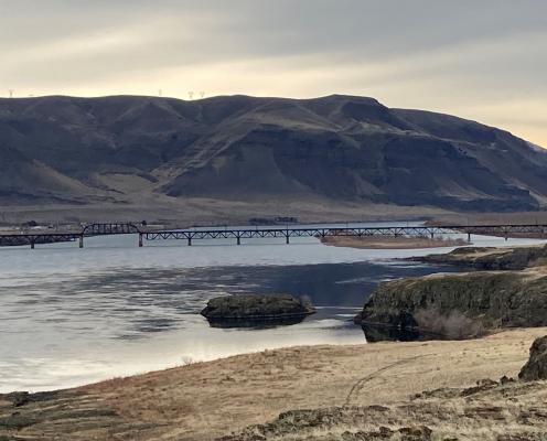 River with mountains and bridge