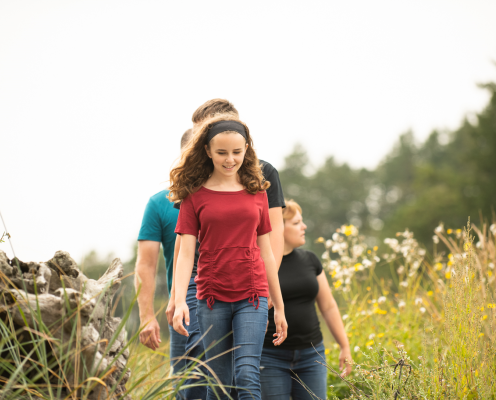 Family walking on a trail at Deception Pass