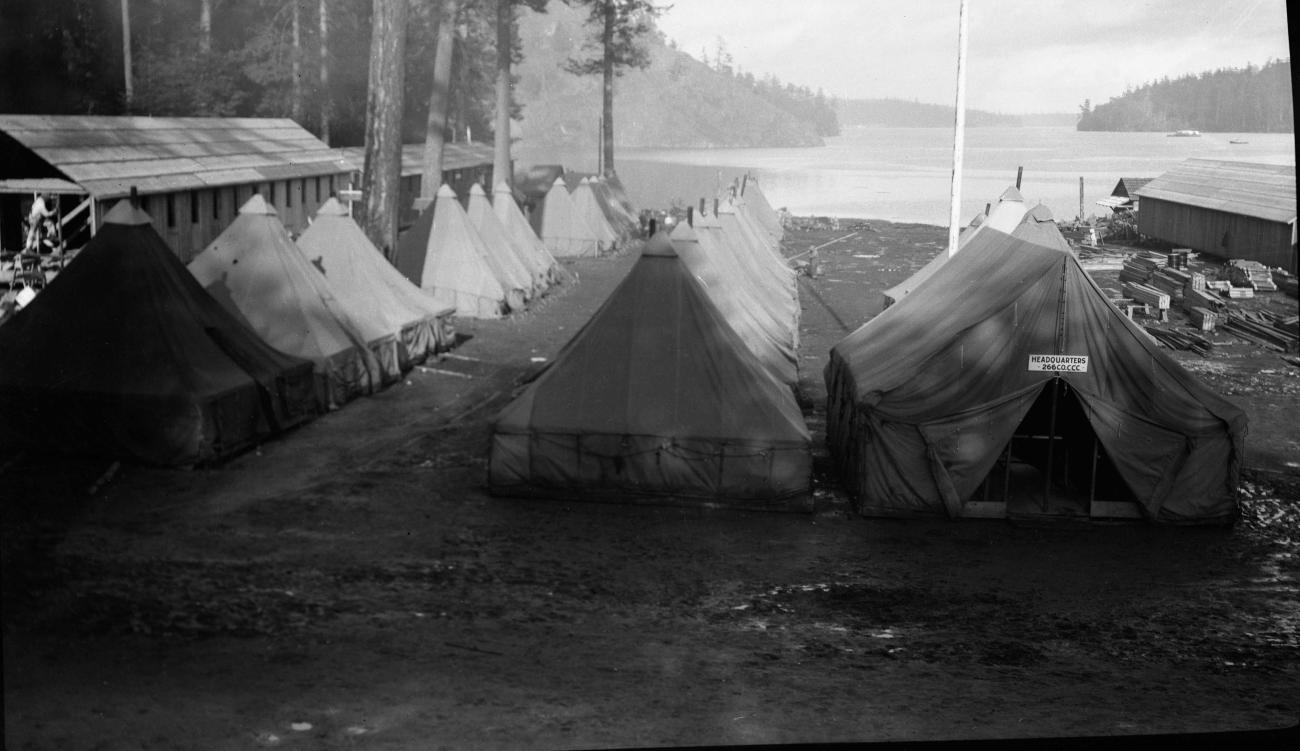 canvas tents in orderly rows near beach