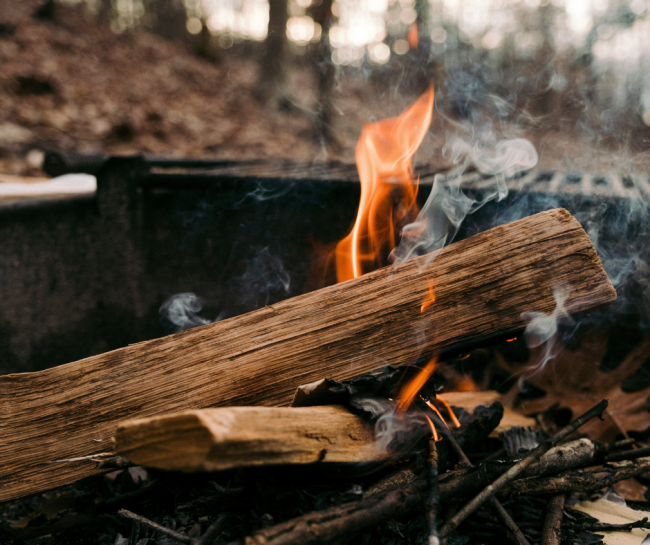 small campfire burning in one of our parks' fire pits