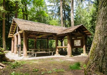 Illahee State Park picnic shelter in forest with trees outdoors