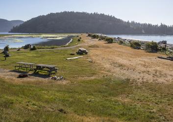 Picnic tables on Spencer Spit on a sunny day