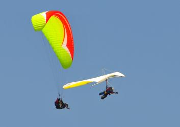 Paragliders and Hang-Gliders in the sky.