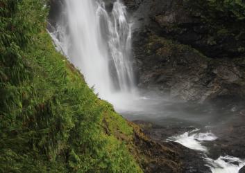 waterfalls plunging into river