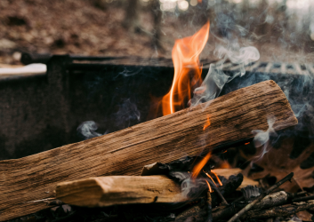 small campfire burning in one of our parks' fire pits