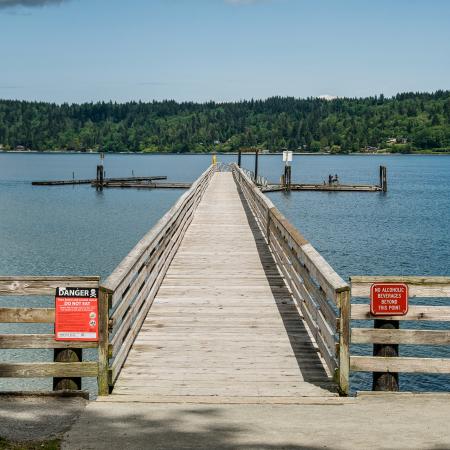 Illahee State Park, pier with moorage dock on port orchard bay and view of bainbridge island