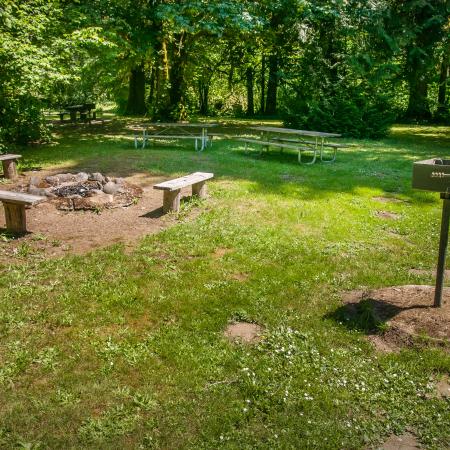 Lewis & Clark group camp fire circle with bench seats and picnic table close by