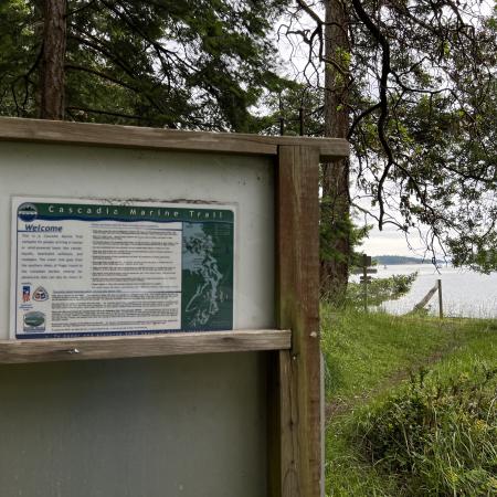visitor sign showing trail of Cascadia