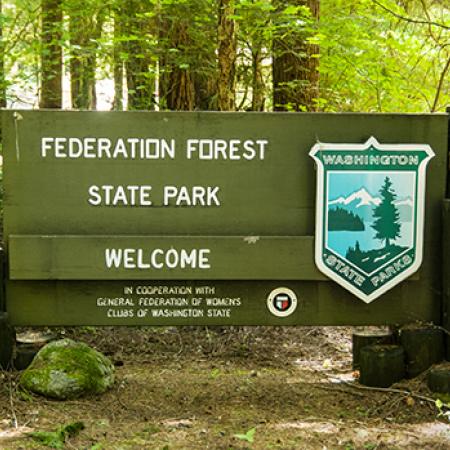 Welcome sign at Federation Forest State Park.