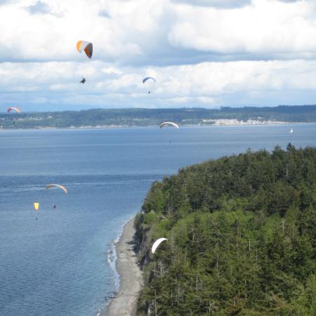 Paragliding at Fort Flagler above shoreline.