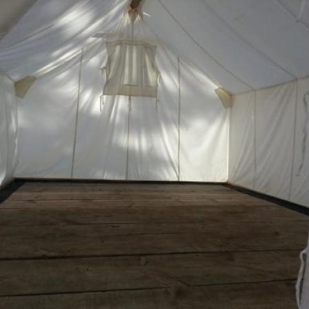 Inside wall tent with wooden floors