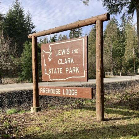 Lewis and Clark State Park wooden sign showing "Firehouse Lodge"