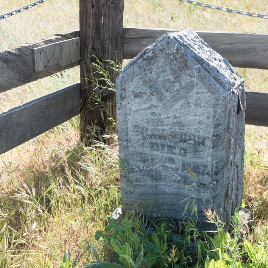 headstone in old marked grave site