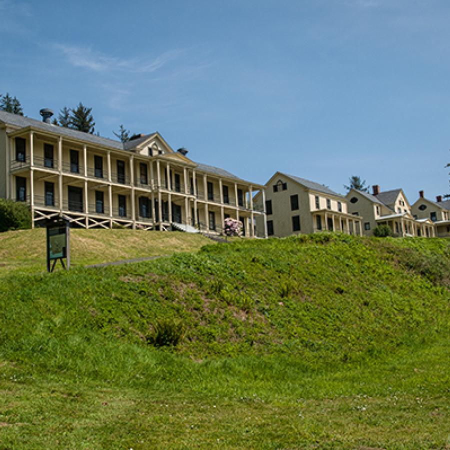 The dormitory with a grassy hill at Fort Columbia State Park.