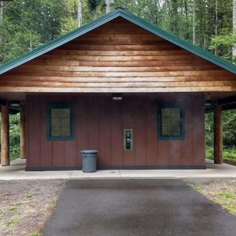 Bathroom and Shower facilities building in wood tone with green roof