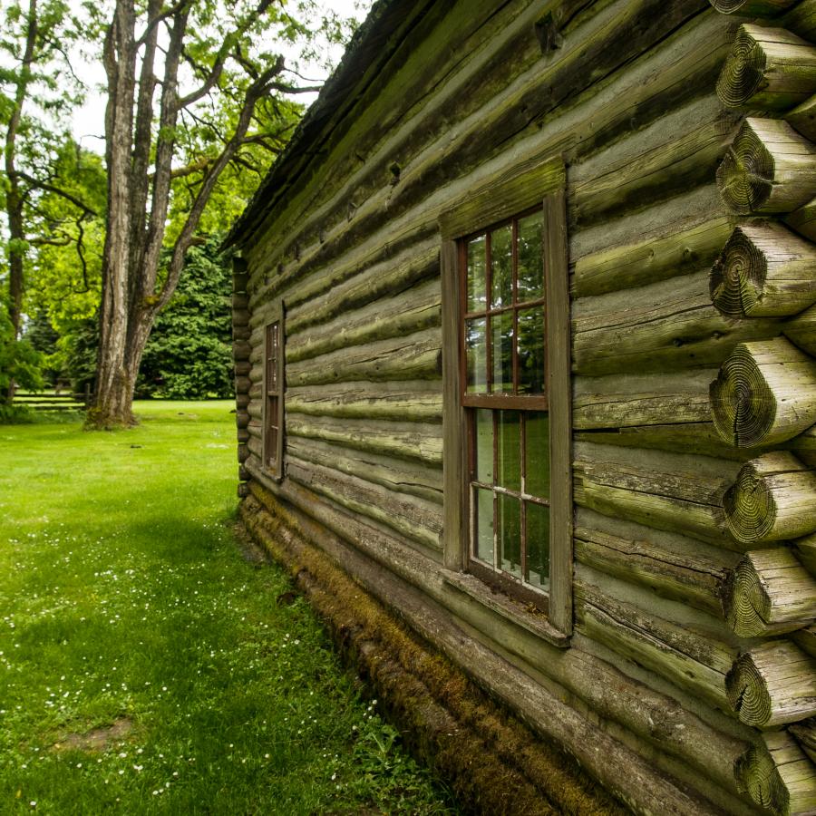 side view up close of round log cabin