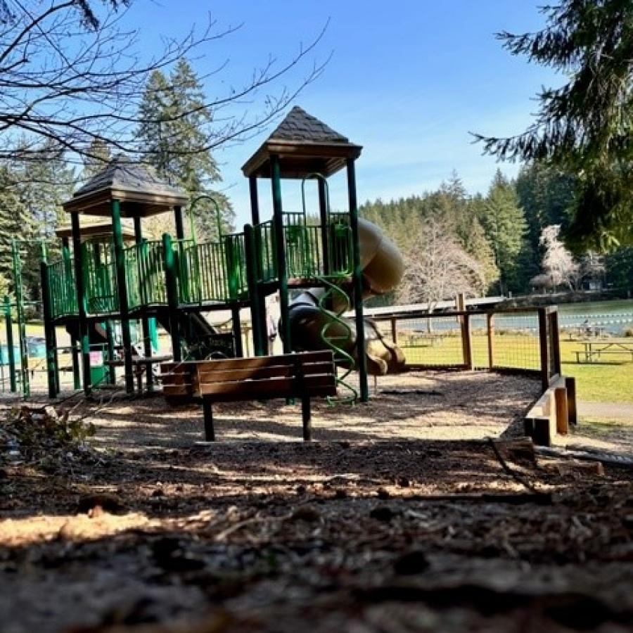 kids playground with park bench