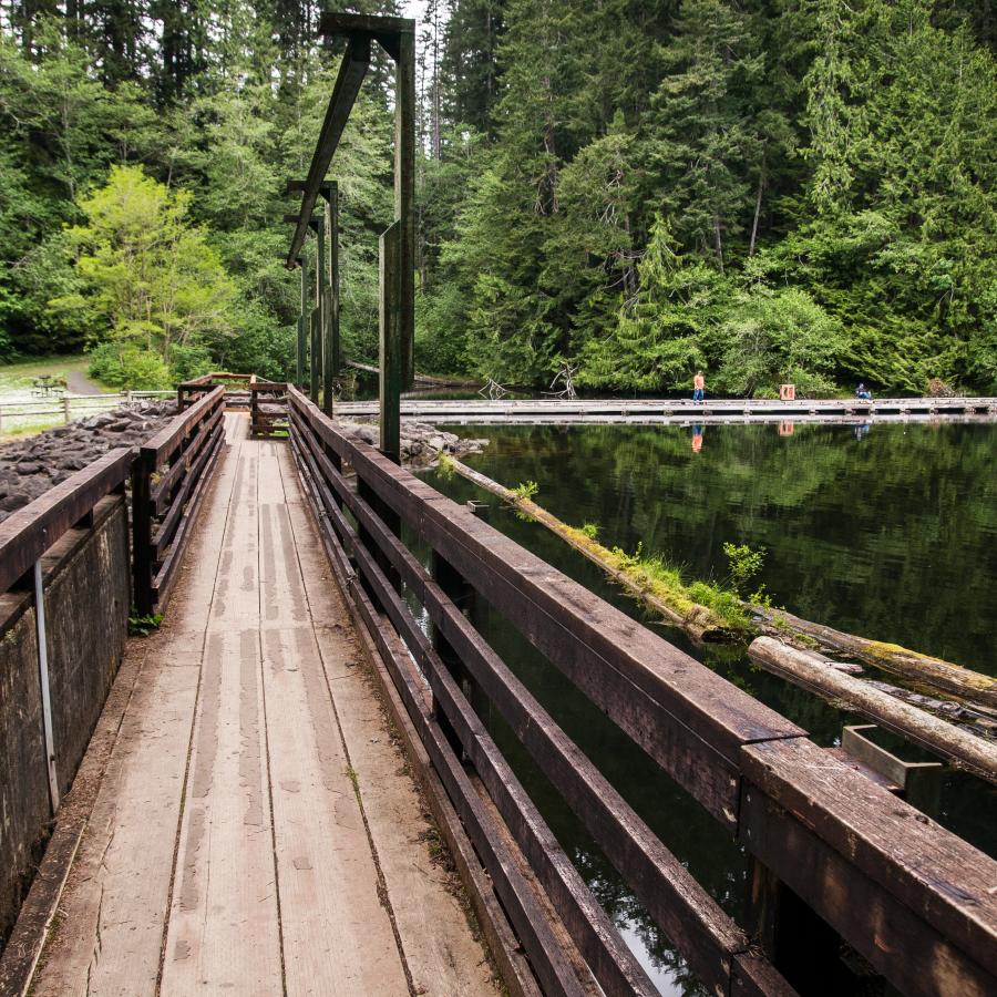 long wooden bridge over lake