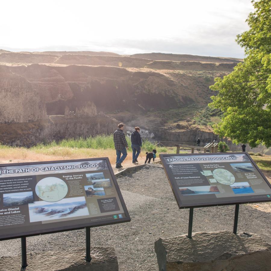 Two interpretive signs about floods are at the start of a pathway that lead to the viewpoint for the waterfall.