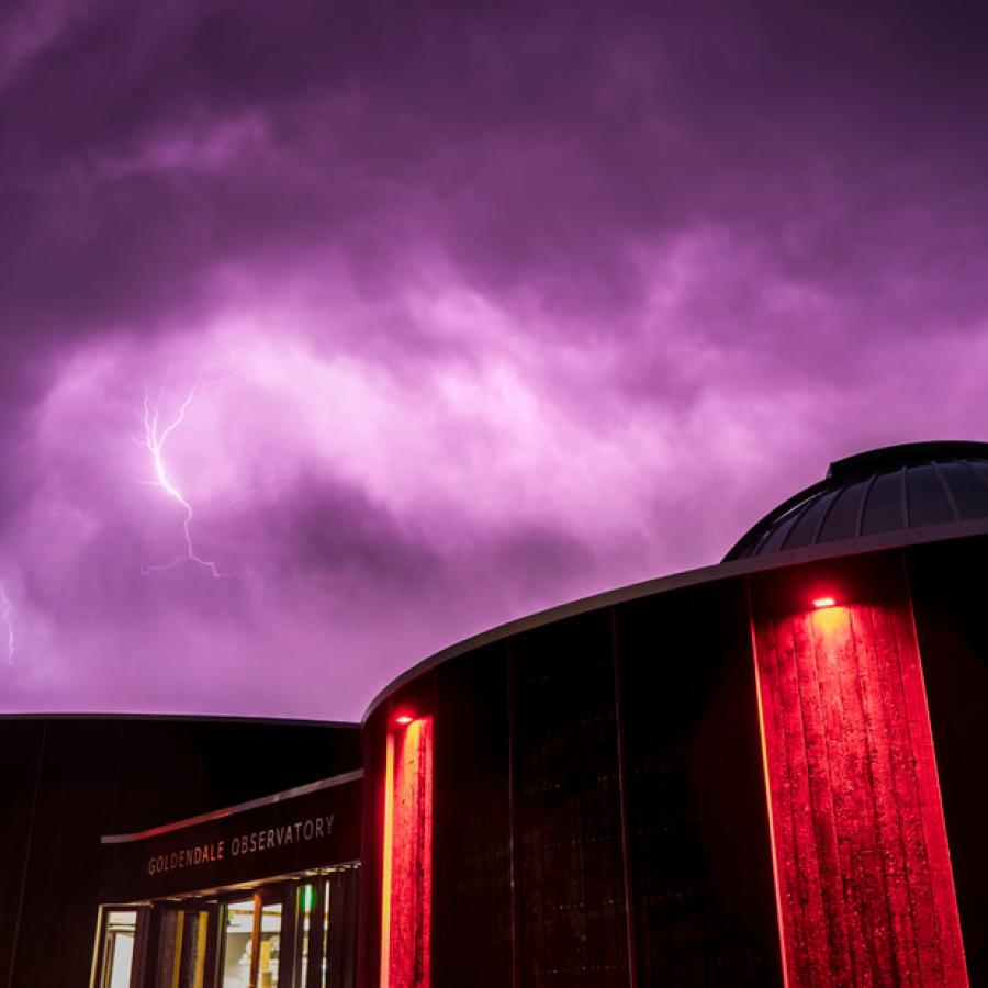 Lightning with purple clouds over Goldendale observatory.