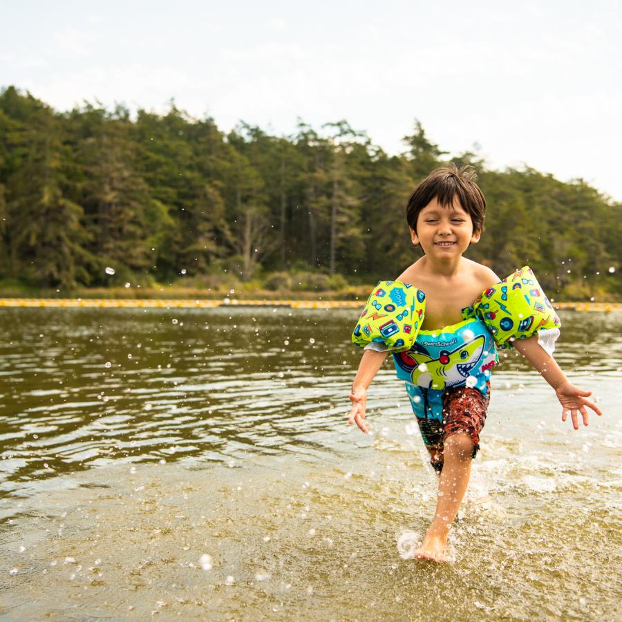 Boy splashing in water.