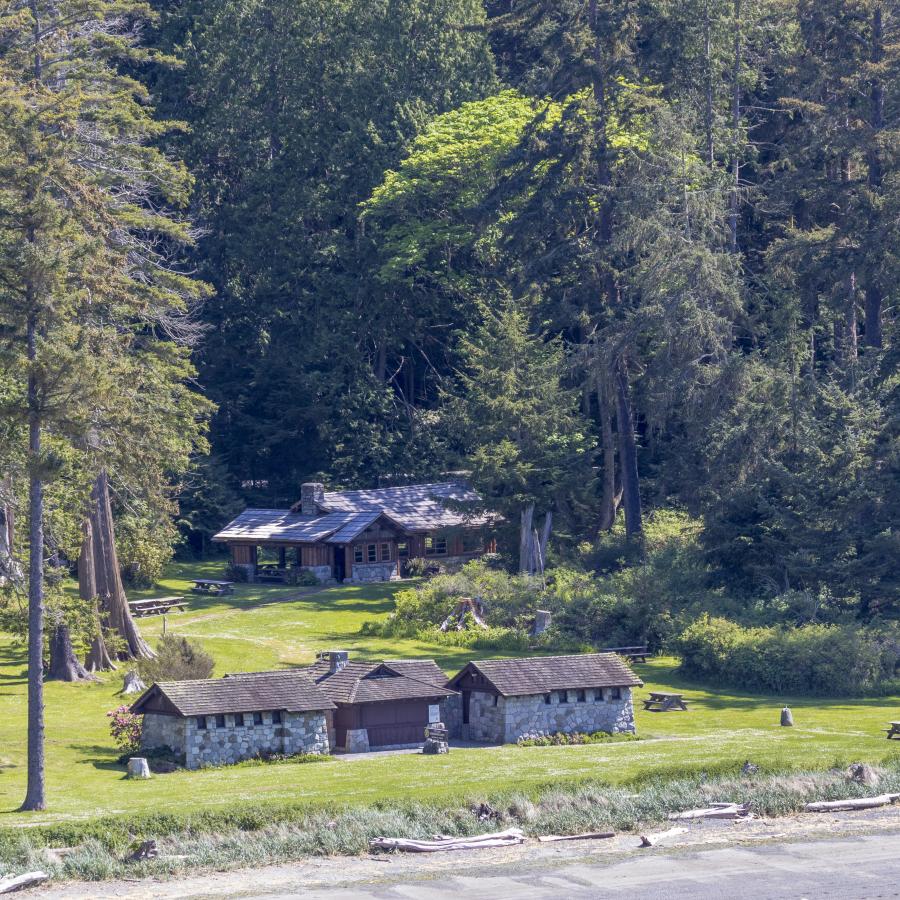 Ariel view of the interpretive center with the beach visible in the front of the picture. A kitchen shelter sits in the background, behind the interpretive center.