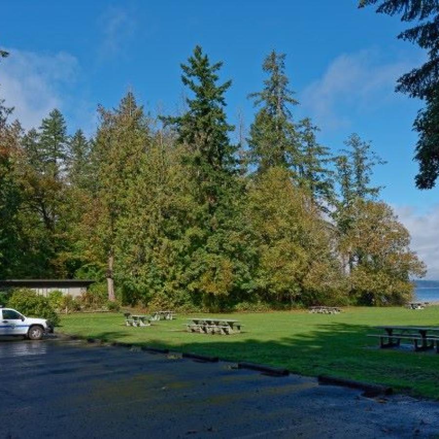 Penrose Point grassy area with trees and truck