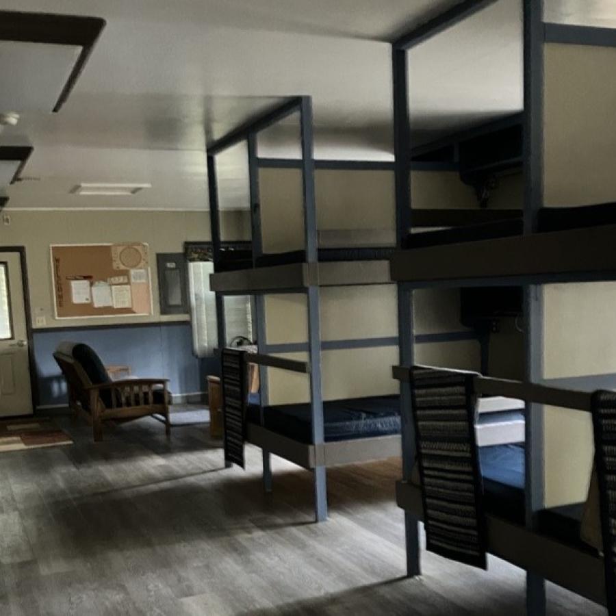 Bunkbeds inside Lodge along long hallway 