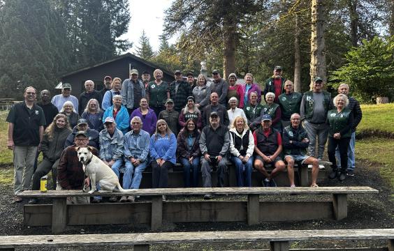 Group photo of volunteers on bleachers at 2024 Host Camporee